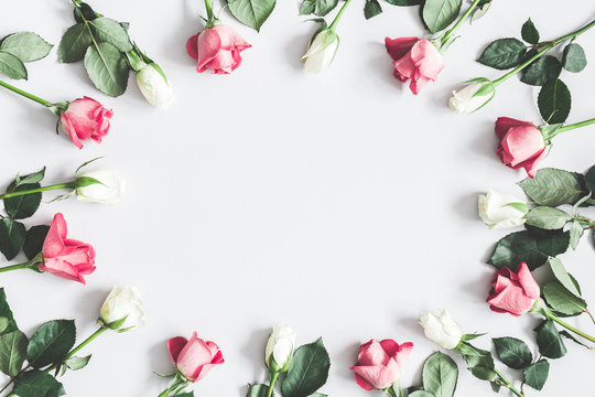 Fototapeta Flowers composition. Pink and white rose flowers on pastel gray background. Flat lay, top view, copy space