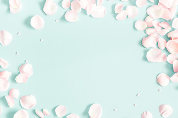 Flowers composition. Rose flower petals on pastel blue background. Valentine's Day, Mother's Day concept. Flat lay, top view, copy space
