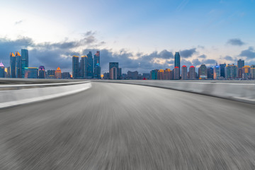 Fototapeta premium Empty asphalt road along modern commercial buildings in China,s cities