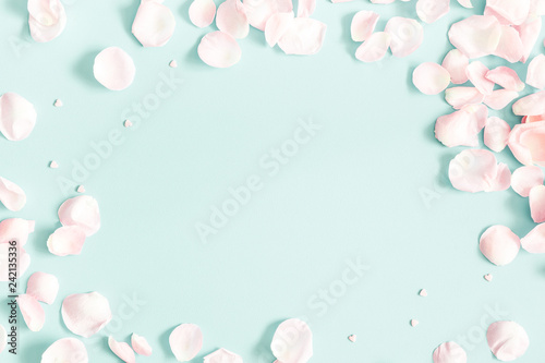 Flowers composition. Rose flower petals on pastel blue background. Valentine's Day, Mother's Day concept. Flat lay, top view, copy space
