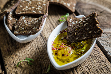 Rye bread crackers dipped in olive oil