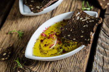 Rye bread crackers dipped in olive oil