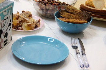 Bright blue stylish accent on the relaxed atmosphere of the table. Unpresentable appearance of photos of everyday dishes.