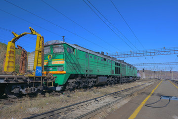 Fototapeta na wymiar Trans Siberian railway track platform view and blue sky, Russia