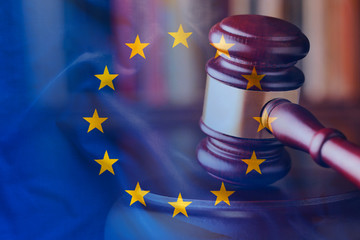 Strike of wooden gavel with EU flag concept