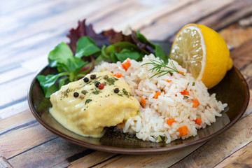 Andalusian fish, saffron rice with vegetables