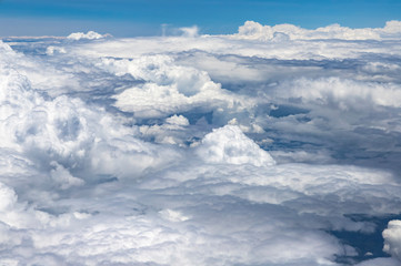 Flying above a dense layer of white clouds. Great and beautiful clouds. 