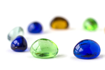 Fototapeta premium Color glass balls , green, blue, white, orange. White background.