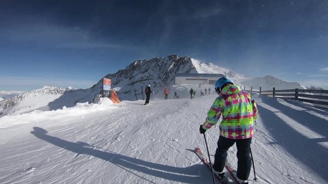 Winter time in Alps and skiers 