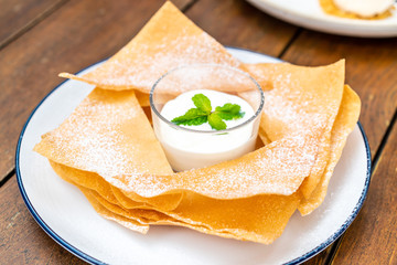 crispy roti with milk and white chocolate sauce
