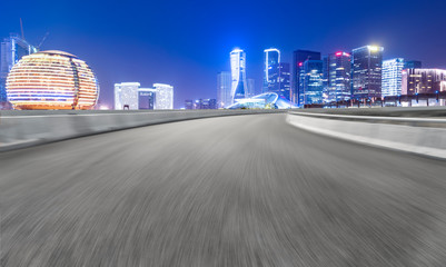 Road Pavement and Night View of Hangzhou Urban Architecture..