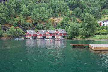 Naklejka premium Boathouses at the Auerlandsfjord in Flam.