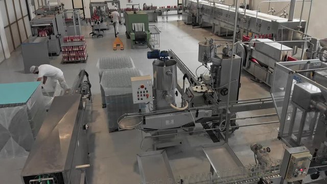 Tomato Sauce factory. Machinery,workers,food.Aerial view
