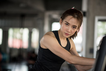 Asian woman on treadmill in the gym