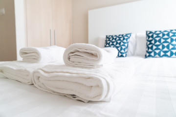 white towel decoration on bed