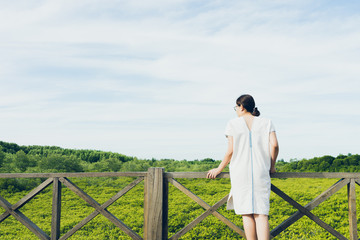 Beautiful young tourists Stand admiring mangrove forest (Ceriops decandra) Also known as the Golden Meadow Prong destinations of Rayong, Thailand is a natural shoreline.