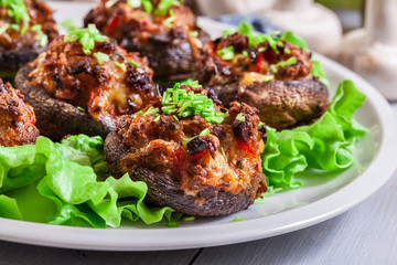 Baked champignon caps stuffed with minced meat