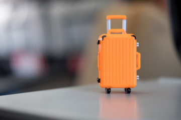 Miniature of orange suitcase