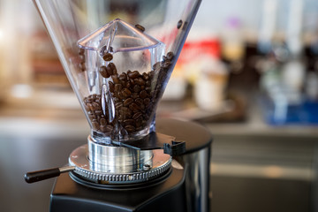 Roasted coffee beans in the glass jar to mixes coffee