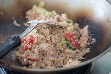 Fried rice with pork and vegetable in a frying pan