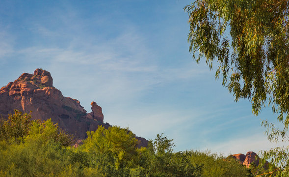 Landscape photos of the iconic "Praying Monk," which is a rock formation that sits on the end of Camelback Mountain in Phoenix, Arizona. Looks like a monk is kneeling down to pray lots of good hiking 