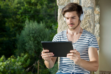 Fototapeta premium young man listening music