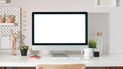 Desktop computer screen on white desk