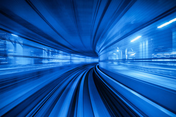 Motion blur of Automatic train moving inside tunnel in Tokyo, Japan. - Powered by Adobe