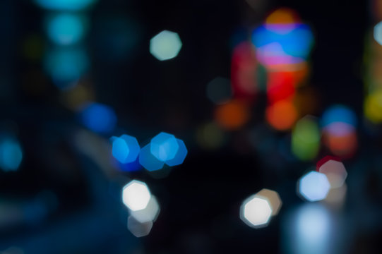 Abstract blurred textures surface pattern design bright colorful glitter geometry octagon bokeh background of Lighting from cars on the road and decorative light in the city at night time - Powered by Adobe