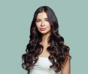 Healthy hair woman. Perfect girl with long curly hairstyle. Hair care concept