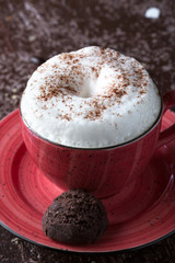 Coffee with milk and chocolate biscuit