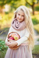 Happy little child, baby girl playing in autumn on nature walk outdoors. Autumn background. Family walk in park. School time. childhood happiness. Fall season. 