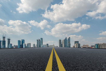 Empty asphalt road along modern commercial buildings in China,s cities