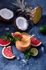 Grapefruit, pineapple, coconut cocktail or smoothie, tropical fruit refreshing summer drink