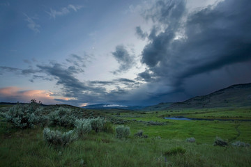 Storm over meadows of Lamar Valley, Yellowstone, at Sunset