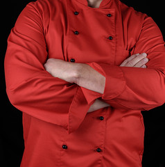 chef in red uniform crossed his arms over his chest