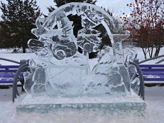 An ice sculpture of a snowman in winter Park