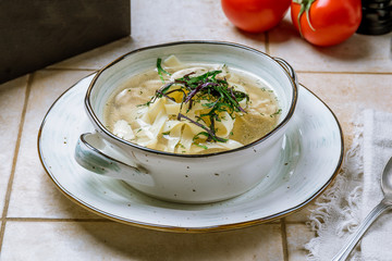 Chicken soup bouillon in a plate