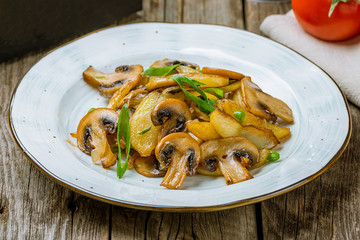 Fried potatoes with mushrooms