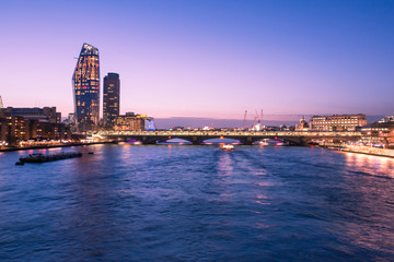 London Skyline at Dusk with Thames River, Bridge and City Buildings