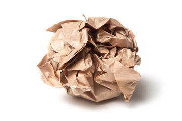 closeup of brown paper ball on white background