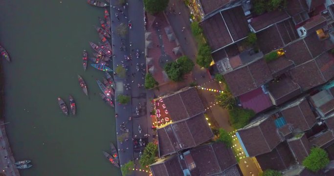 Aerial view of Hoi An old town or Hoian ancient town in night. Royalty high-quality free stock video footage top view of Hoai river and boat traffic Hoi An. Hoi An street and river in night with light