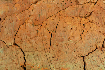 texture of old cracked red brick during firing from clay, close-up