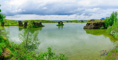 Fototapeta na wymiar Lake Myvatn with various volcanic rock formations