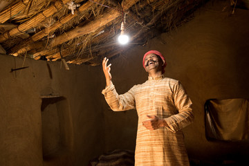 Rural Indian man delighted on electricity reaching her home
