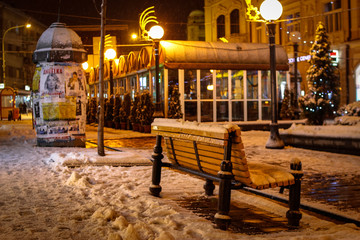 Fototapeta na wymiar Streets of the town at night covered with snow. Kragujevac town in Serbia.