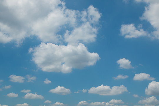 blue sky , cumulus fluffy clouds