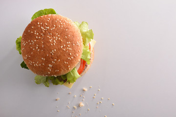 Burger on white table top view