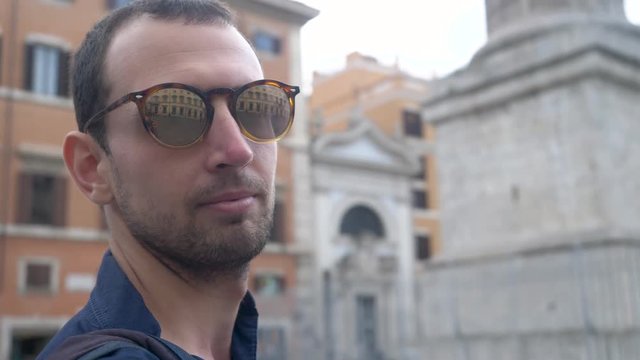 Handsome Young Man Wearing Sunglasses In Trendy European City.