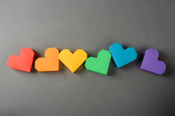 Six colorful hearts on gray